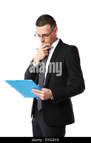 Handsome businessman reading document over white background Stock Photo