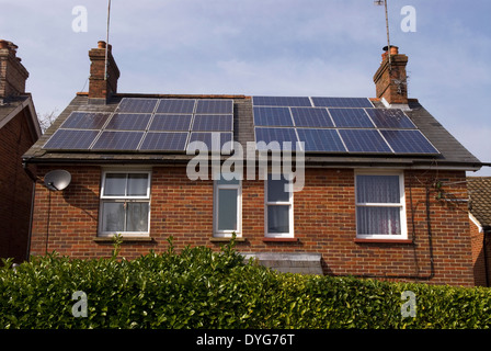 House with solar panels on roof, Lindford, near Bordon, Hampshire, UK. Stock Photo