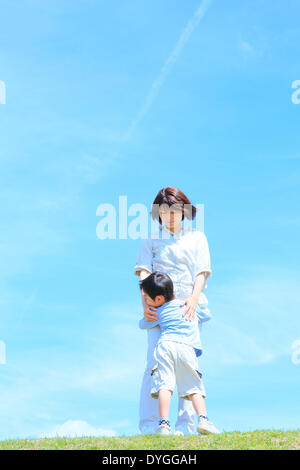 Japanese mum and son on a hill Stock Photo - Alamy