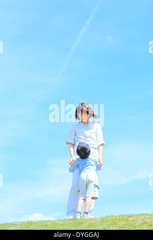 Japanese mum and son on a hill Stock Photo - Alamy