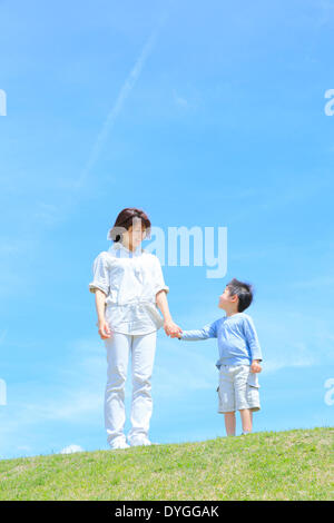 Japanese mum and son on a hill Stock Photo - Alamy