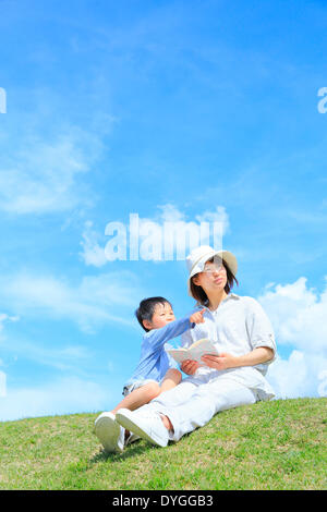 Japanese mum and son on a hill Stock Photo - Alamy