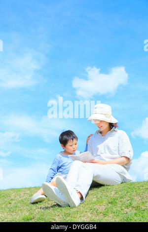 Japanese mum and son on a hill Stock Photo - Alamy