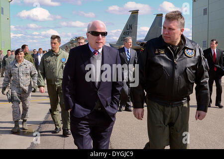 US Senator John McCain speaks with Maj. Gen. Edvardas Maeikis, Lithuanian air force commander, at Siauliai Air Base April 16, 2014 in Siauliai, Lithuania. McCain and two other senators are visiting the Baltic NATO members to show support during the Ukrainian crisis. Stock Photo