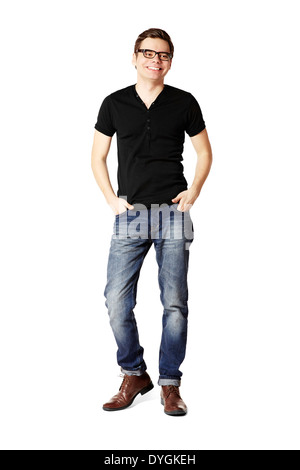 Studio shot of smiling man in black t-shirt and blue jeans. Stock Photo