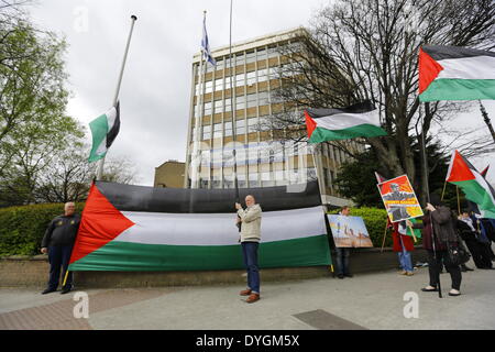 Dublin, Ireland. 17th April 2014. Pro Palestinian protesters stand outside the Israeli Embassy in Dublin with large Palestinian flags. Pro-Palestinian activists assembled outside the Israeli Embassy in Dublin, to commemorate the 5th anniversary of Bassem Abu Rahmah. The Bil'in resident was killed in the West Bank village during a protest after being hit by a tear gas canister. Credit:  Michael Debets/Alamy Live News Stock Photo