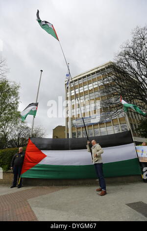 Dublin, Ireland. 17th April 2014. Pro Palestinian protesters stand outside the Israeli Embassy in Dublin with large Palestinian flags. Pro-Palestinian activists assembled outside the Israeli Embassy in Dublin, to commemorate the 5th anniversary of Bassem Abu Rahmah. The Bil'in resident was killed in the West Bank village during a protest after being hit by a tear gas canister. Credit:  Michael Debets/Alamy Live News Stock Photo