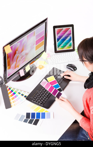 Graphic designer at work. Color swatch samples. Stock Photo