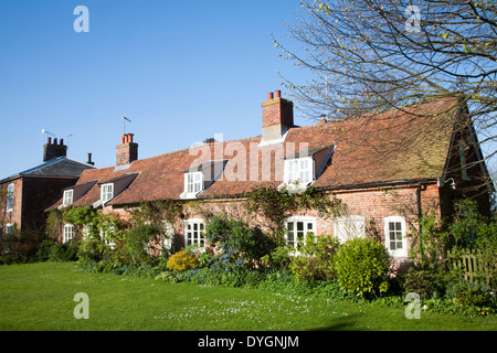 Traditional brick country cottage with dormer windows tile roof and ...