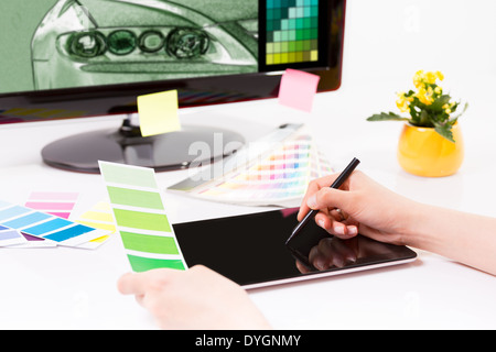Graphic designer at work. Color swatch samples. Stock Photo