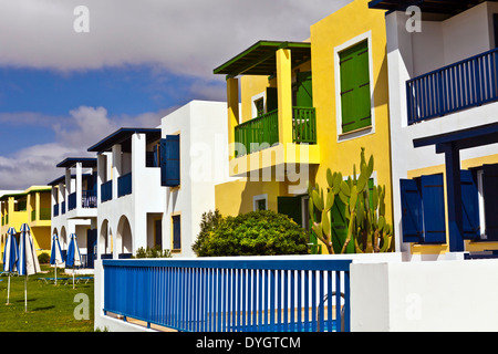 Row of modern two storey flat roof holiday homes by the seaside. Stock Photo