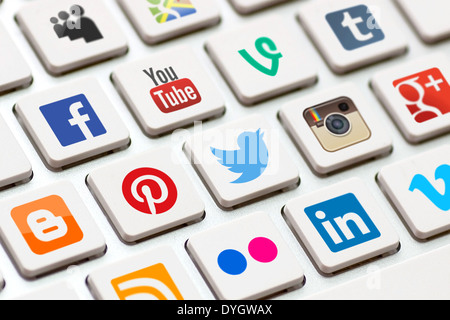 BELCHATOW, POLAND - MAY 02, 2013: Modern white keyboard with colored social network buttons. Stock Photo