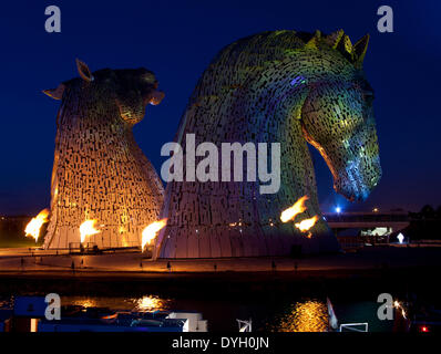 The Helix project, Falkirk, Scotland, UK. 17th Apr.2014. Andy Scott’s giant equine artworks 'The Kelpies' the illuminated spectacular, The Kelpies are 30 metre high horse-head sculptures, standing next to the Forth and Clyde Canal in The Helix, a new parkland project built to connect 16 communities in the Falkirk Council Area, Scotland Stock Photo