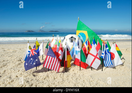 International football country flags with soccer ball on Ipanema beach in Rio de Janeiro Brazil Stock Photo