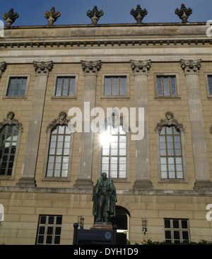 Blue sky view statue chemist Eilhard Mitscherlich, and sun shining windows Humboldt University, Platz der Marzrevolution, Berlin Stock Photo