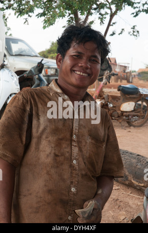 Mechanic at a roadside garage in Mondulkiri province, Cambodia Stock Photo