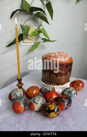 traditional Russian Orthodox treat for Easter sweet cake and decoration red eggs Stock Photo