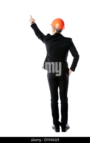 Back view portrait of a businessman in protective helmet directing works over white background Stock Photo