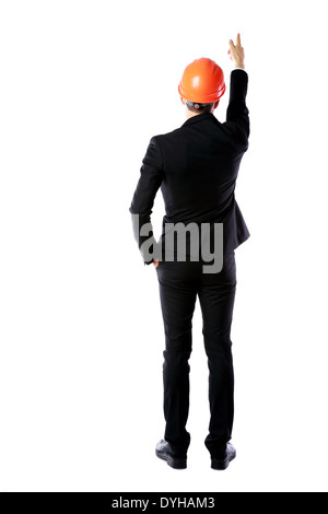 Back view portrait of a businessman in protective helmet directing works over white background Stock Photo