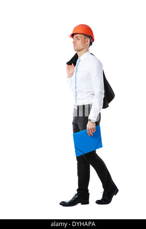 Pensive businessman in helmet with blue folder over white background Stock Photo