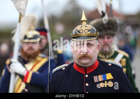 Sonderborg, Denmark. 18th Apr, 2014. Soldiers in historic uniforms take part in the ceremony to mark the 150th anniversary of the Battle of Dybbol in Sonderborg, Denmark, 18 April 2014. 150 years ago, the Germans and Danes fought over Schleswig-Holstein. The war climaxed with the Battle of Dybbol. The anniversary on 18 April will be widely celebrated in Denmark. Photo: AXEL HEIMKEN/dpa/Alamy Live News Stock Photo