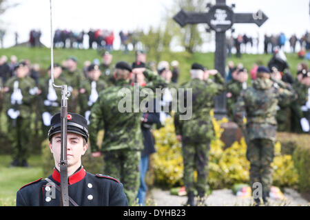 Sonderborg, Denmark. 18th Apr, 2014. Danish soldiers lay wreaths during the ceremony to mark the 150th anniversary of the Battle of Dybbol in Sonderborg, Denmark, 18 April 2014. 150 years ago, the Germans and Danes fought over Schleswig-Holstein. The war climaxed with the Battle of Dybbol. The anniversary on 18 April will be widely celebrated in Denmark. Photo: AXEL HEIMKEN/dpa/Alamy Live News Stock Photo