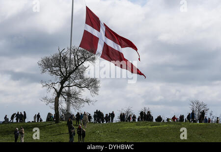 Sonderborg, Denmark. 18th Apr, 2014. Danish citizens take part in the ceremony to mark the 150th anniversary of the Battle of Dybbol in Sonderborg, Denmark, 18 April 2014. 150 years ago, the Germans and Danes fought over Schleswig-Holstein. The war climaxed with the Battle of Dybbol. The anniversary on 18 April will be widely celebrated in Denmark. Photo: AXEL HEIMKEN/dpa/Alamy Live News Stock Photo