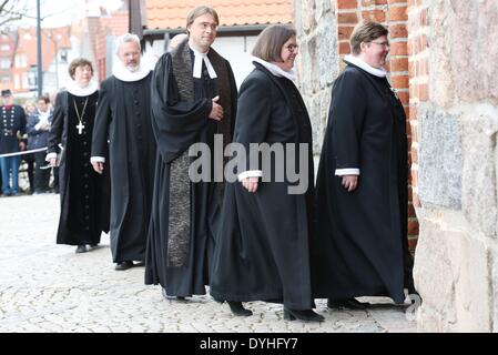 Sonderborg, Denmark. 18th Apr, 2014. Clerics arrive for a service during the ceremony to mark the 150th anniversary of the Battle of Dybbol in Sonderborg, Denmark, 18 April 2014. 150 years ago, the Germans and Danes fought over Schleswig-Holstein. The war climaxed with the Battle of Dybbol. The anniversary on 18 April will be widely celebrated in Denmark. Photo: BODO MARKS/dpa/Alamy Live News Stock Photo