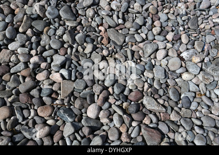 Pebbles and stones at the picturesque harbour at Cove Bay, Aberdeen city, Scotland, UK Stock Photo