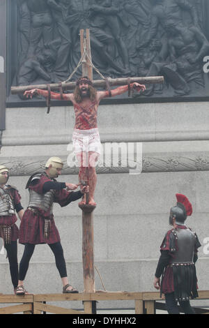 London UK. 18th April 2014. Actors from the Wintershall players who are based on the Wintershall Estate in Surrey perform The Passion of Jesus on Good Friday to crowds in Trafalgar Square London.  The production of 'The Passion of Jesus' includes a cast of actors, horses, a donkey and authentic costumes of Roman soldiers in the 12th Legion of the Roman Army Credit:  amer ghazzal/Alamy Live News Stock Photo