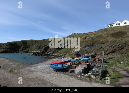 Small fishing boats at the picturesque harbour at Cove Bay, Aberdeen city, Scotland, UK Stock Photo