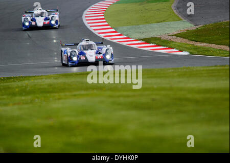 Northampton, UK. 18th Apr, 2014. #8 Toyota Racing Toyota TS 040 Hybrid of Anthony Davidson (GBR), Nicolas Lapierre (FRA), Sebastien Buemi (CHE) and #7 Toyota Racing Toyota TS 040 Hybrid of Alexander Wurz (AUT), Stephane Sarrazin (FRA), Kazuki Nakajima (JPN) in action during the second Free Practice at Round 1 of the 2014 FIA World Endurance Championship from Silverstone Circuit. Credit:  Action Plus Sports/Alamy Live News Stock Photo