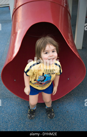 Toddler Emerging from Slide on Playground at Waterfront Park in Louisville Kentucky Stock Photo