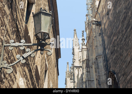 famous Gothic Quarter in Barcelona with focus on foreground street lamp Stock Photo