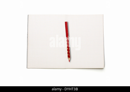 open squared blank book with red pencil, isolated on white . Stock Photo