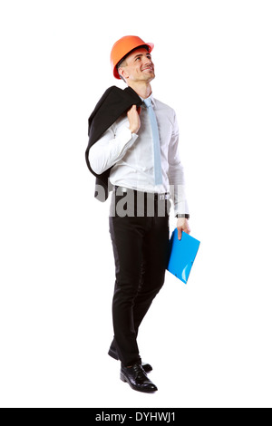 Happy businessman in helmet with blue folder over white background Stock Photo