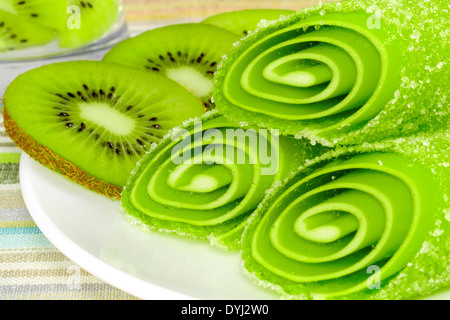 candy fruit with slices kiwi on a plate, closeup Stock Photo