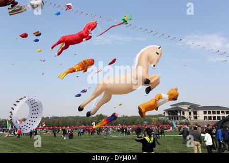 Weifang, China's Shandong Province. 19th Apr, 2014. Kites fly in the sky during the 31st Weifang International Kite Festival in Weifang, east China's Shandong Province, April 19, 2014. © Zhang Chi/Xinhua/Alamy Live News Stock Photo