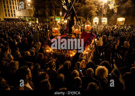 Barcelona, Spain. April 18th, 2014: Thousands follow the meet up of the various brotherhoods and their floats in front of Barcelona's Cathedral during the Good Friday procession Credit:  matthi/Alamy Live News Stock Photo