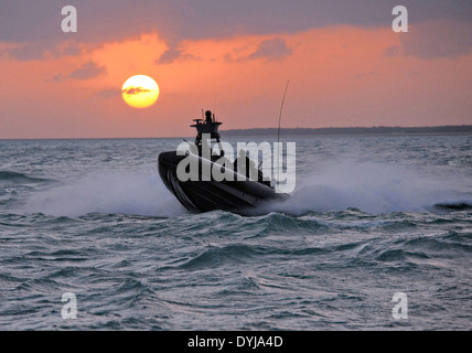 US Navy SEAL Special Warfare Combatant craft Crewmen assigned to Special Boat Team 20 navigates a rigid-hull inflatable boat film a scene in a movie production 'I Am That Man' July 9, 2008 in Key West, Florida. Stock Photo