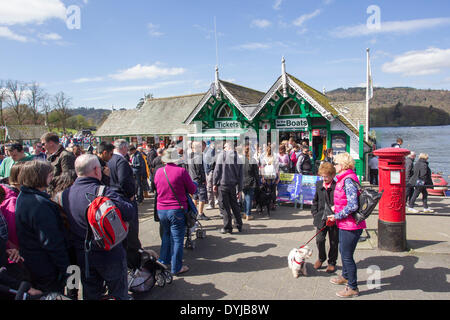 Lake Windermere, Cumbria, UK. 19th April 2014. Tourists makeing the most of sunshine Que for cruises at Bowness Pier head Credit:  Gordon Shoosmith/Alamy Live News Stock Photo