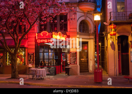 Fan Tan cafe and entrance to Fan Tan Alley in Chinatown lit up at night-Victoria, British Columbia, Canada. Stock Photo