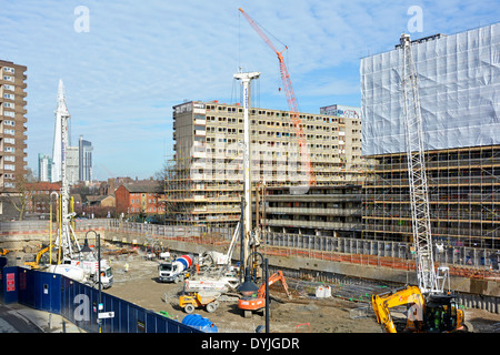 Regeneration work started on part of the site of old Heygate Estate with remaining blocks beyond prepared for demolition Southwark South London uk Stock Photo