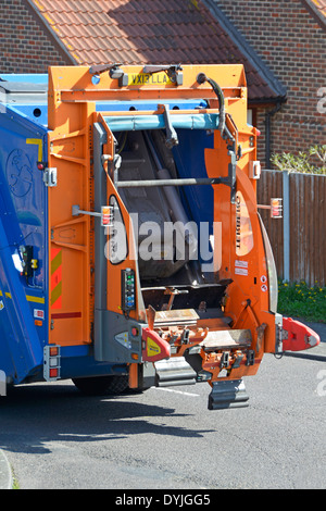 Back of council dustcart showing hydraulic lifting gear for tipping rubbish bins Essex England UK Stock Photo