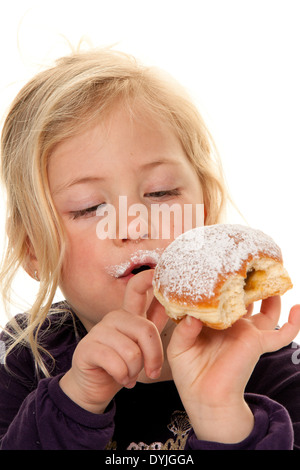 Kind im Fasching mit Krapfen. Faschingskrapfen / Children in carnival with donuts. Carnival doughnut, Blondes Maedchen, 7 Jahre; Stock Photo