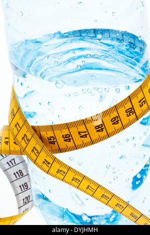 A plastic bottle of mineral water and measuring tape. Symbol diet., Massband; Zentimermass; Stock Photo