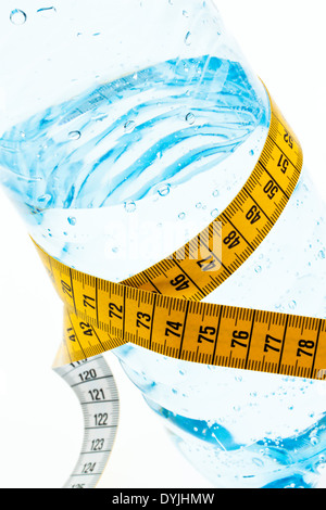 A plastic bottle of mineral water and measuring tape. Symbol diet., Massband; Zentimermass; Stock Photo