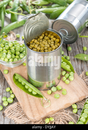 Small portion of canned Peas with some fresh pods Stock Photo