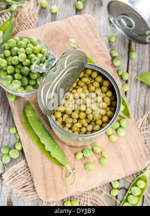 Small portion of canned Peas with some fresh pods Stock Photo