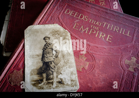 Photograph of John Edward William Samuels (DCM, MM), Royal Field Artillery, on volume of Deeds That Thrill The Empire in which he featured. Stock Photo